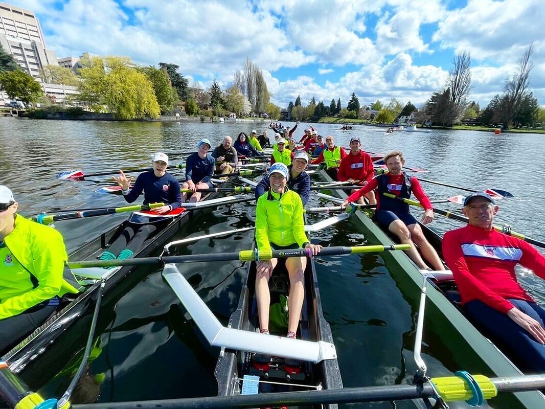 Three eights are pictured next to each other while the rowers smile.