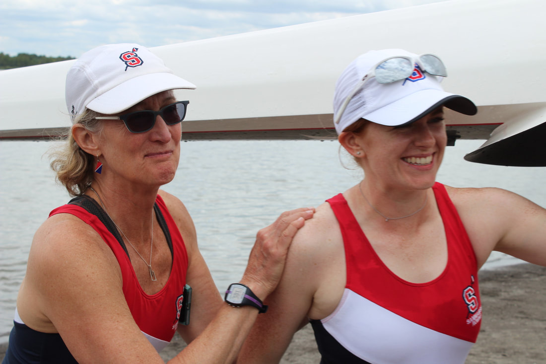 Two masters rowers during a regatta are pictured. 