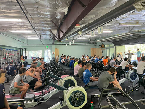 The erg room at the Hod Fowler Boathouse is shown with junior rowers occupying most of the ergs. 